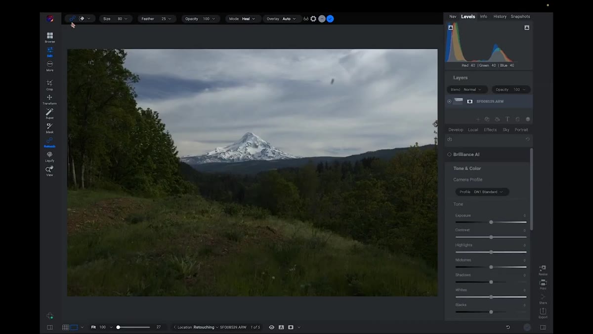 Retouching tools panel open on left side of screen