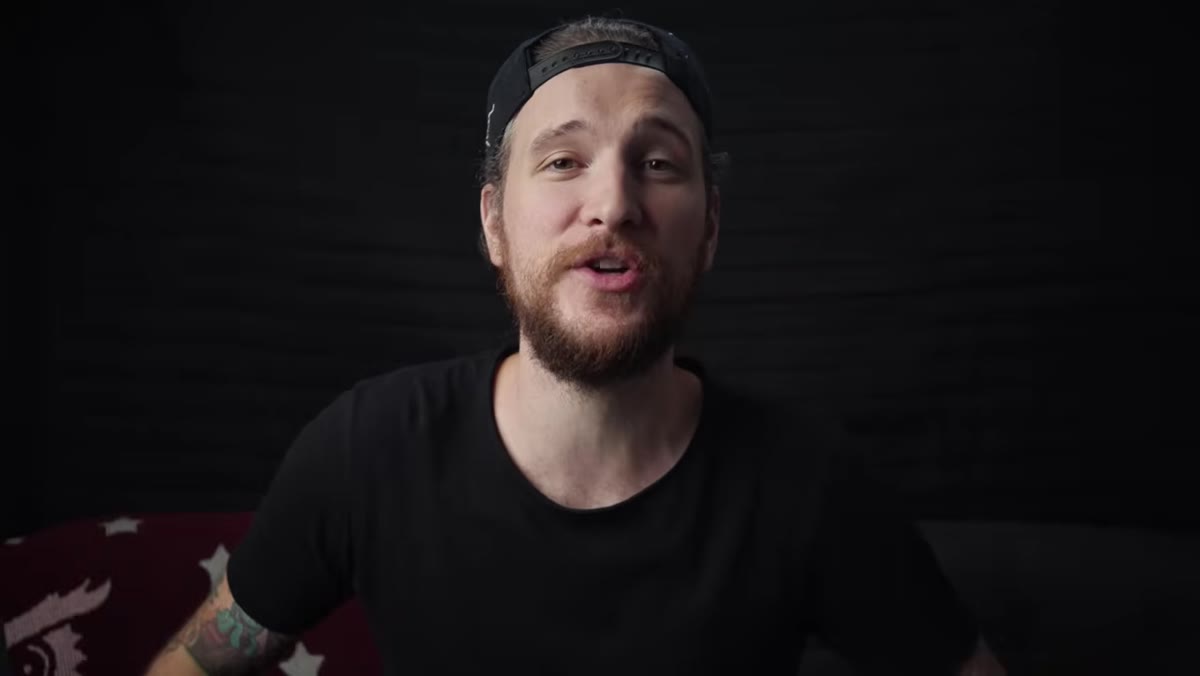 Peter McKinnon at desk opening Lightroom on desktop