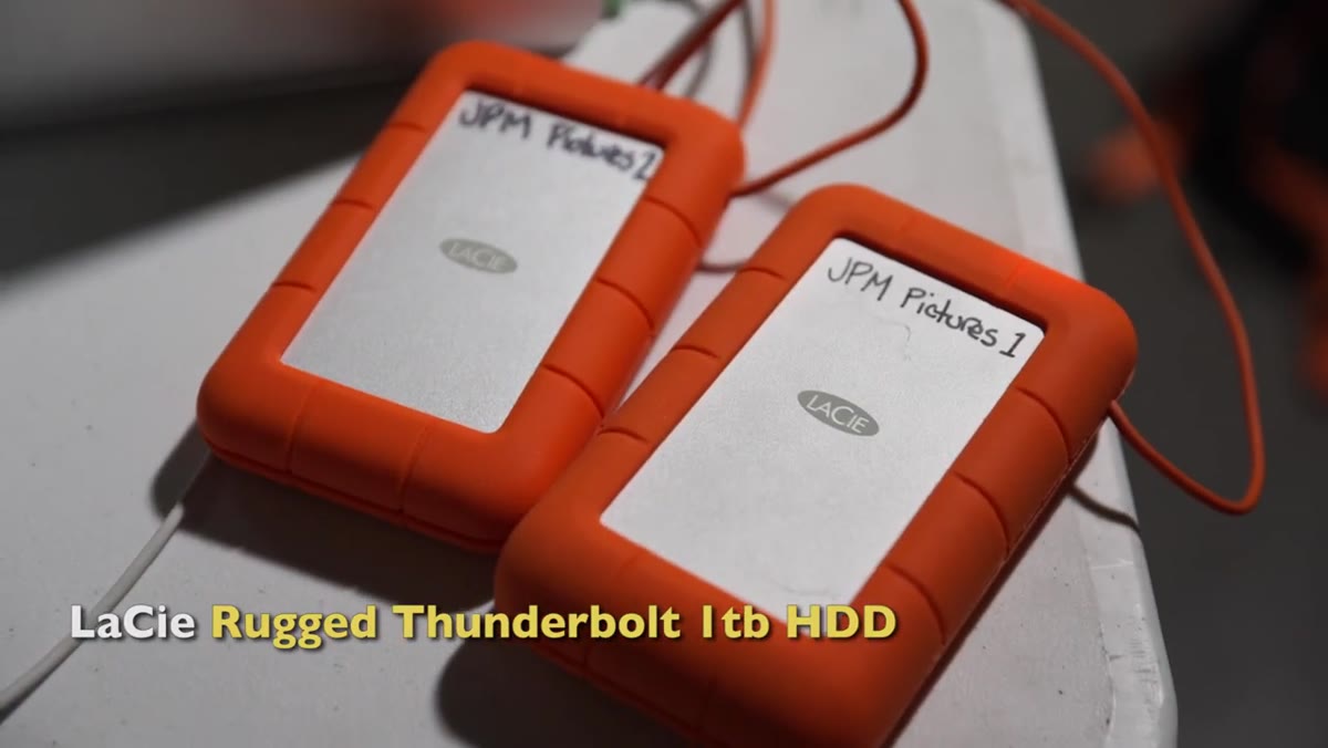 JP holding two LaCie drives before the download process