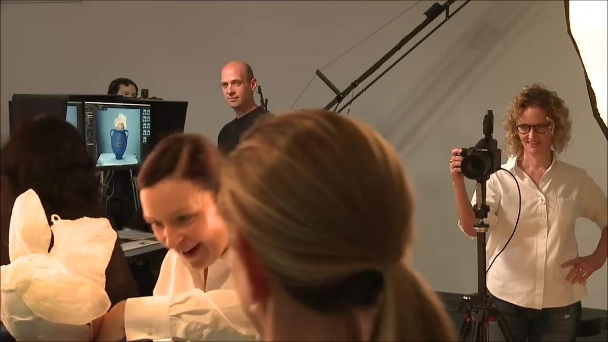 Team calling the baby&rsquo;s name to direct attention toward the camera