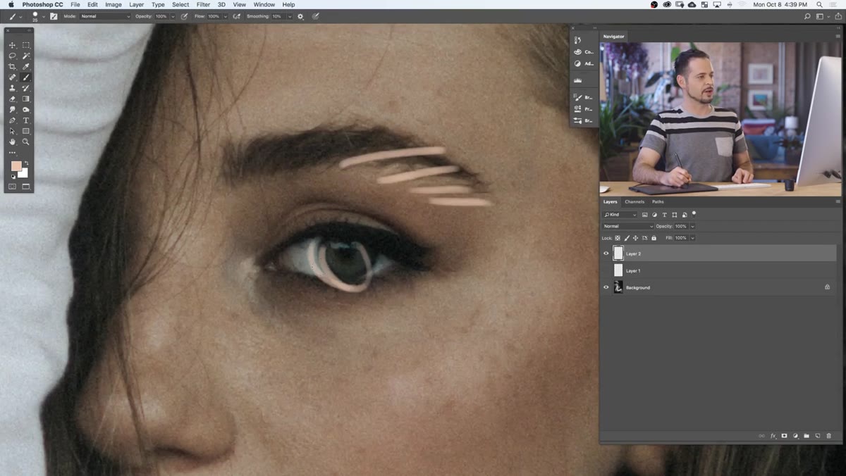 Close-up on eyebrow area showing retouching target zones